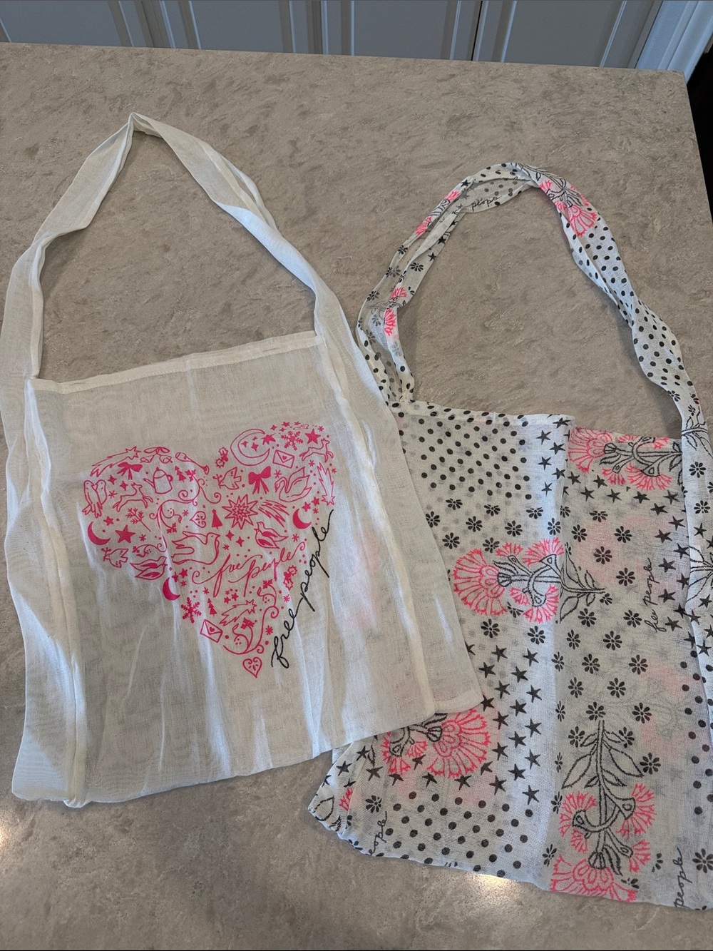 Free People white tote bags with pink design